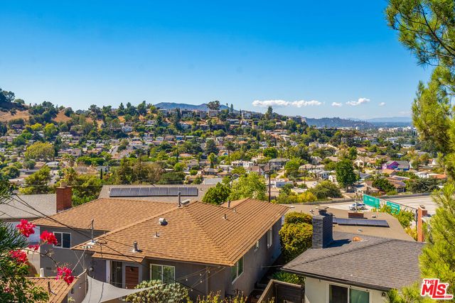 a kitchen with stainless steel appliances a stove a sink and a microwave