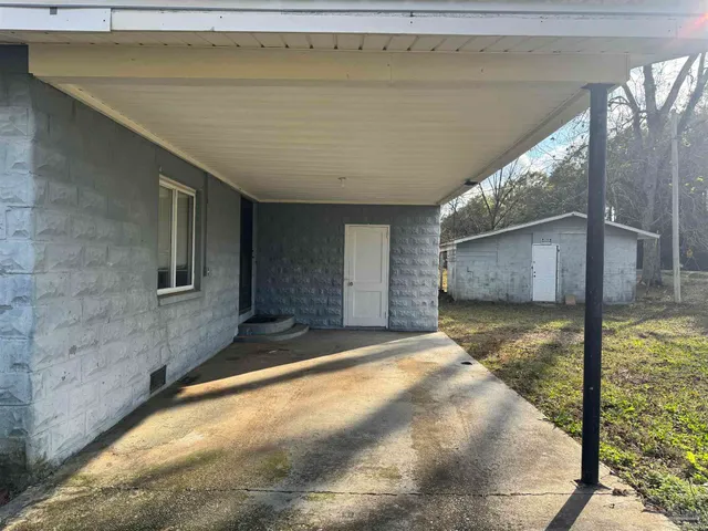 a kitchen with a white stove top oven sink and refrigerator