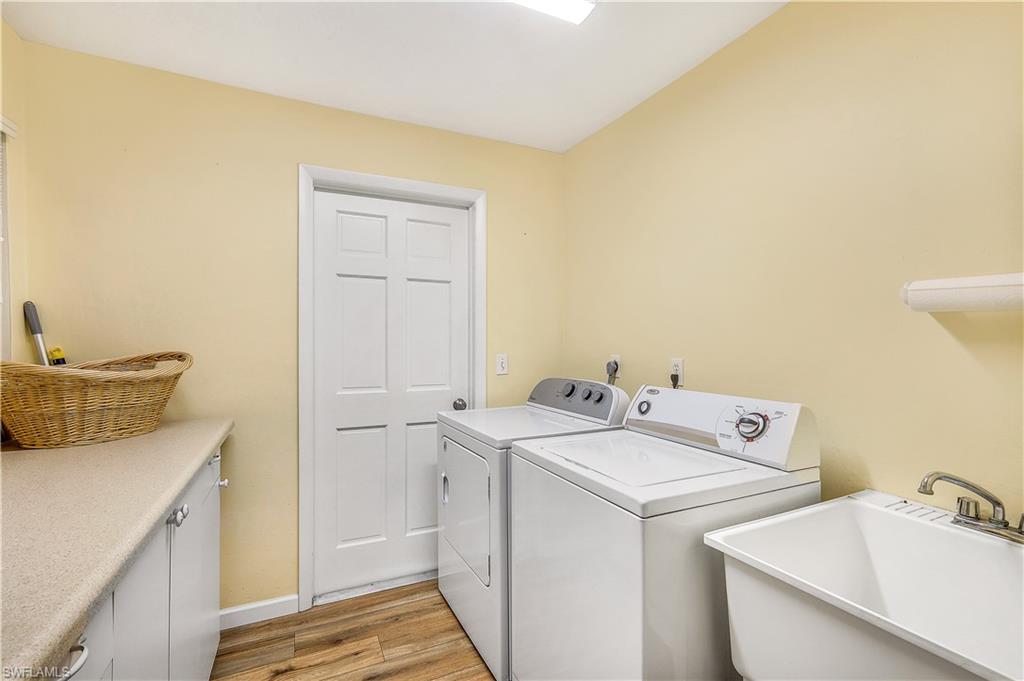 660 Pompano Drive Naples, FL 34110 - Photo 26 of 34 a utility room with dryer and washer