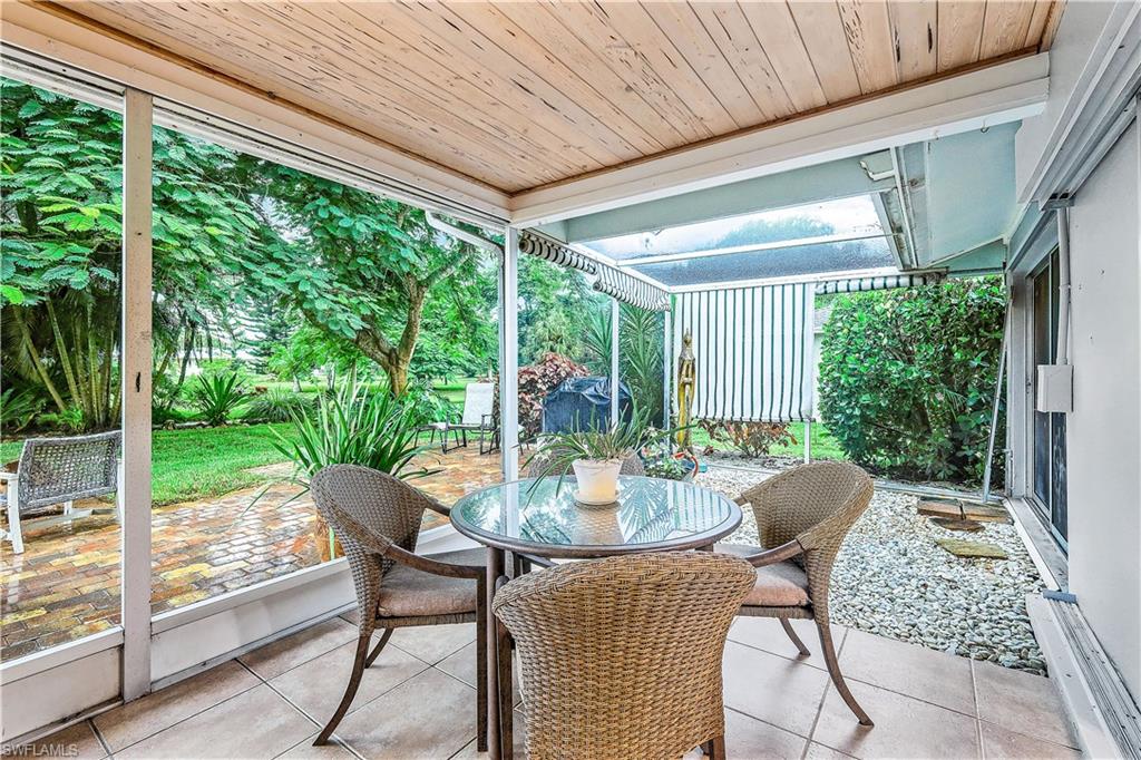 660 Pompano Drive Naples, FL 34110 - Photo 27 of 34 a view of an outdoor space with porch and furniture