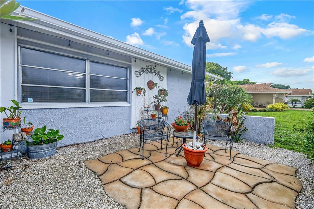 660 Pompano Drive Naples, FL 34110 - Photo 28 of 34 a outdoor space with chairs