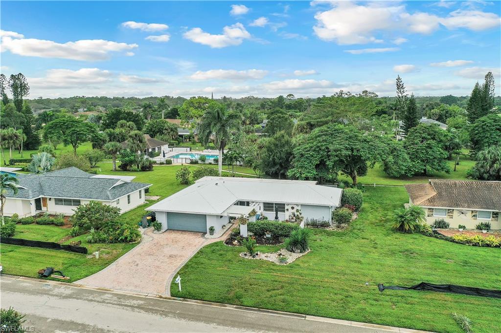 660 Pompano Drive Naples, FL 34110 - Photo 3 of 34 an aerial view of a house with garden space ocean and mountain view in back
