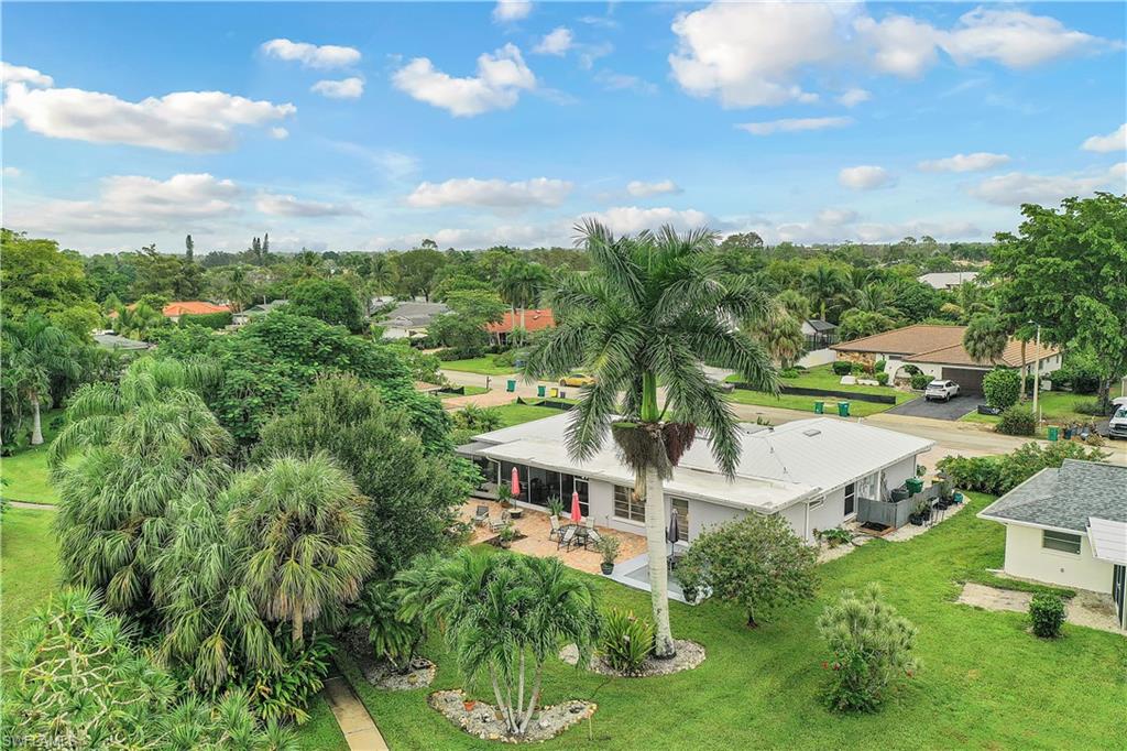 660 Pompano Drive Naples, FL 34110 - Photo 31 of 34 a aerial view of a house with swimming pool and garden