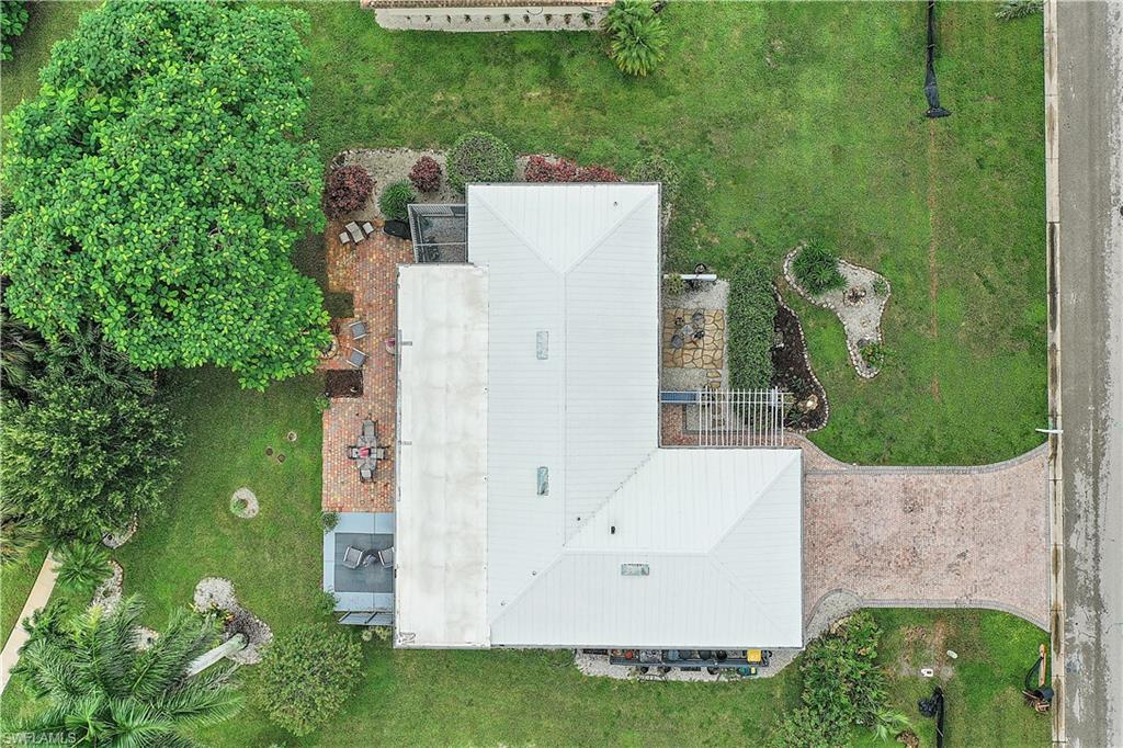 660 Pompano Drive Naples, FL 34110 - Photo 32 of 34 an aerial view of a house with a yard