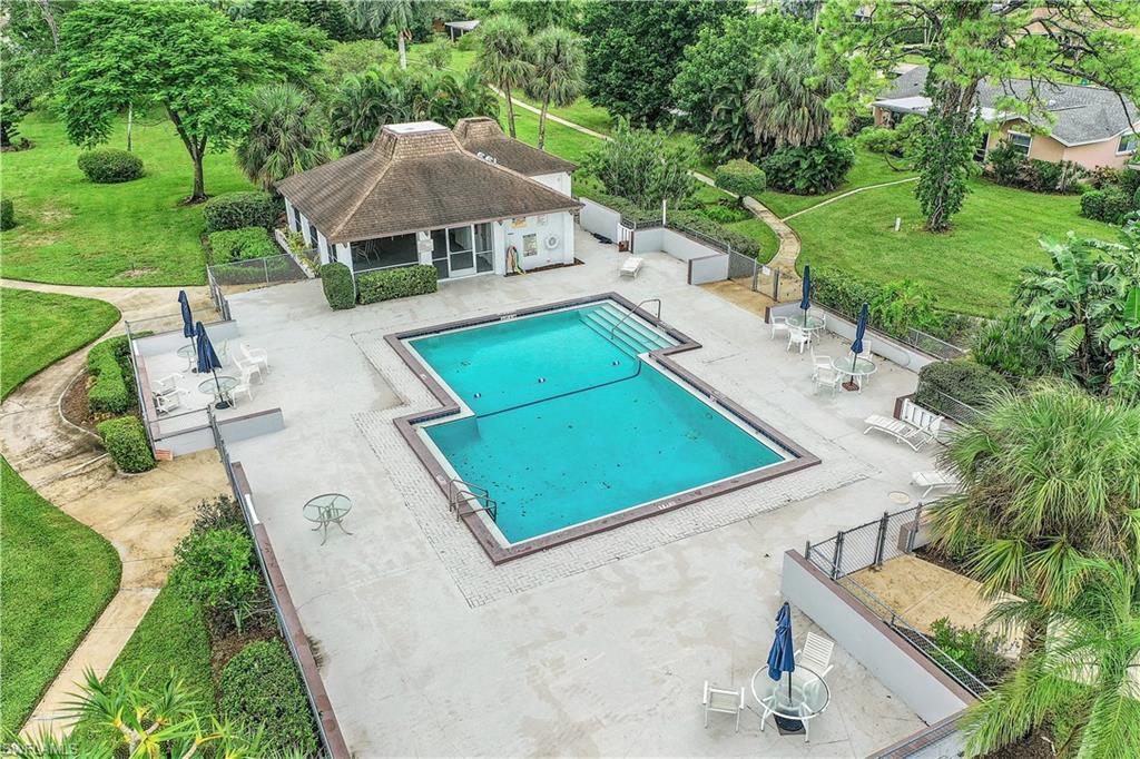 660 Pompano Drive Naples, FL 34110 - Photo 33 of 34 an aerial view of a house with a yard and trees