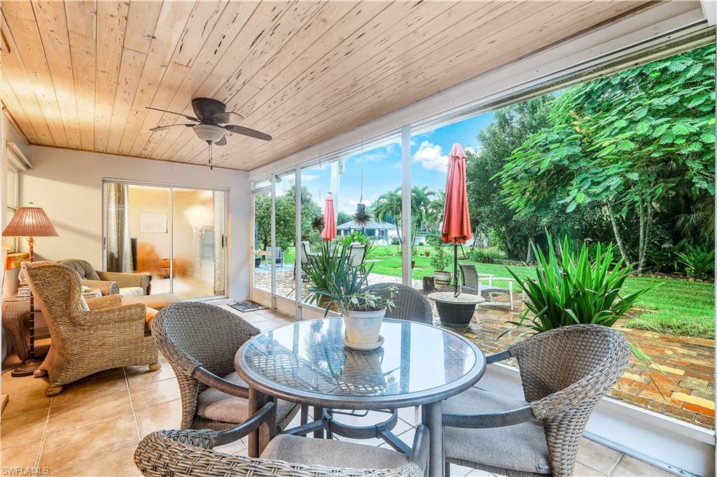 660 Pompano Drive Naples, FL 34110 - Photo 5 of 34 a dining room with furniture garden view and a potted plants