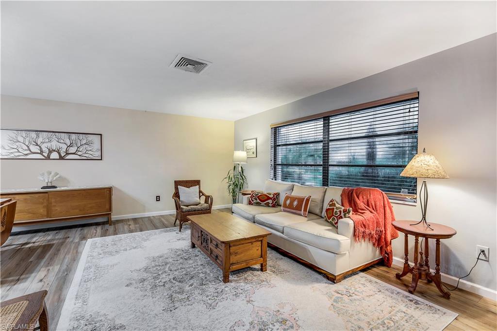 660 Pompano Drive Naples, FL 34110 - Photo 7 of 34 a living room with furniture and a window