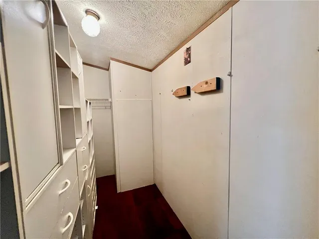 a bathroom with a sink and mirror with toilet