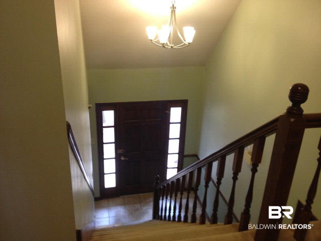 111 Woodside Drive Daphne, AL 36526 - Photo 18 of 31 View from the balcony area of the front door that opens to a full width porch for rocking.