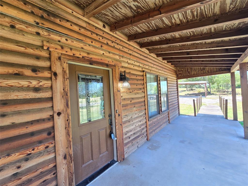 3505 Farmer Road Azle, TX 76020 - Photo 2 of 40 Spacious front porch ready for your own outdoor furniture.