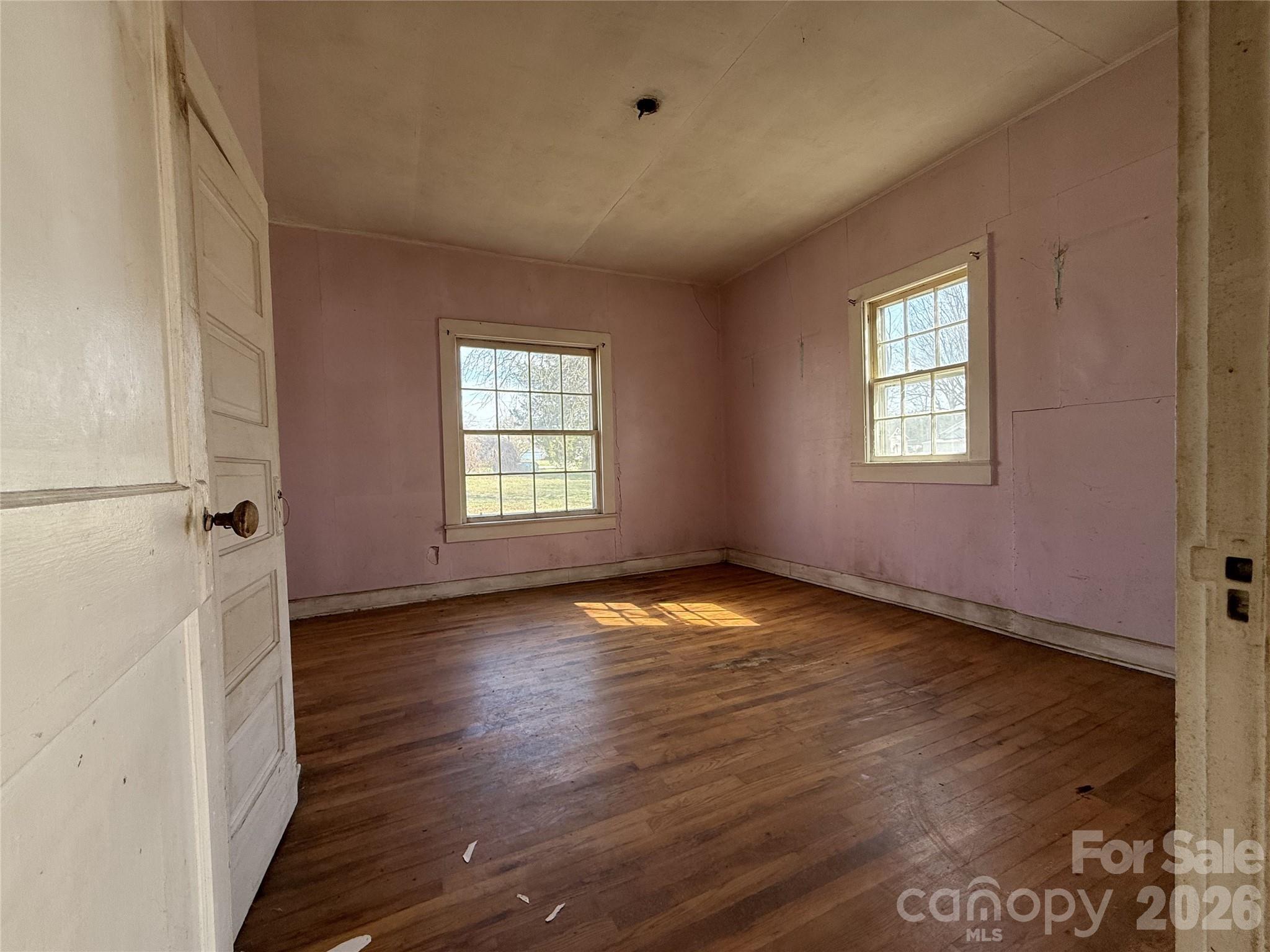 0 Campground Road Denver, NC 28037 - Photo 7 of 11 an empty room with wooden floor and windows