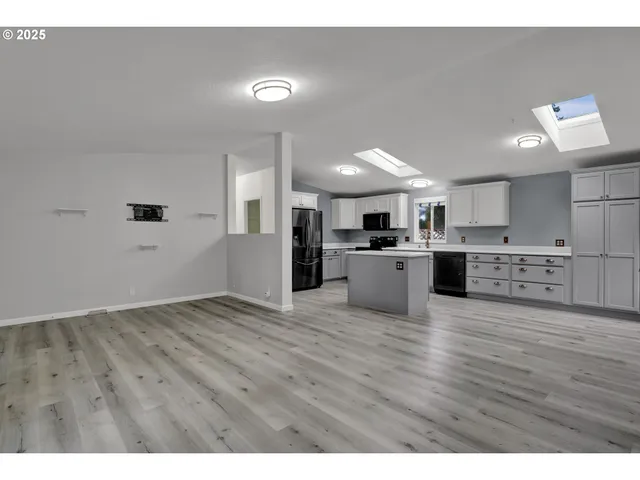 a view of kitchen with wooden floor
