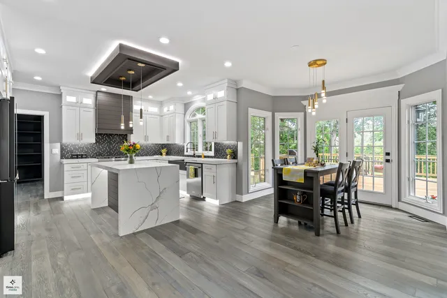 a view of kitchen with cabinets and wooden floor