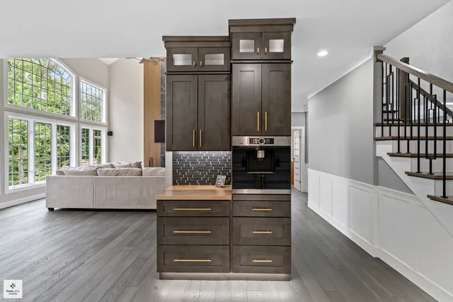 a living room with furniture and large window