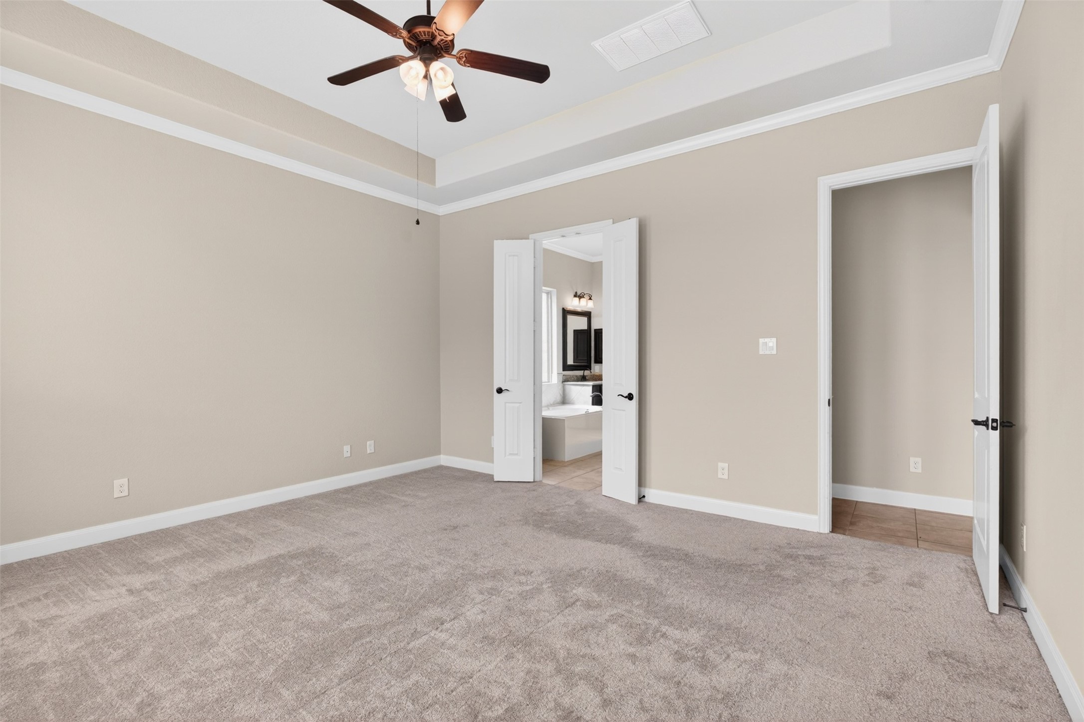 18202 Wedgewood Bluff Court Spring, TX 77379 - Photo 26 of 50 Primary bedroom view showing neutral finishes and private bath access.