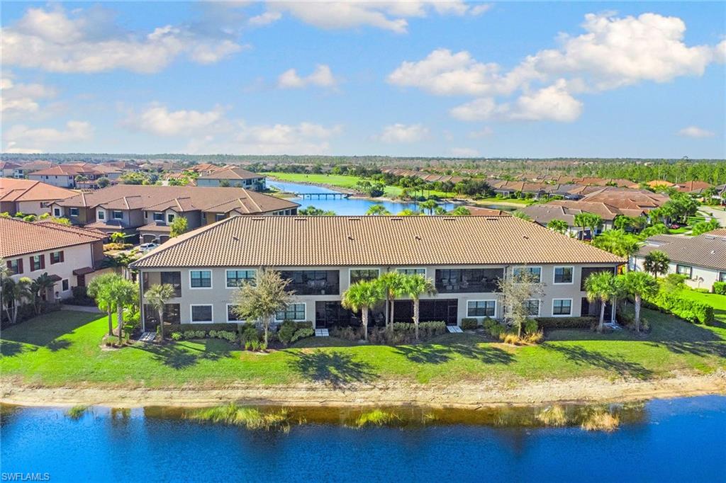 9633 Montelanico Loop, Unit 203 Naples, FL 34119 - Photo 29 of 33 an aerial view of a house