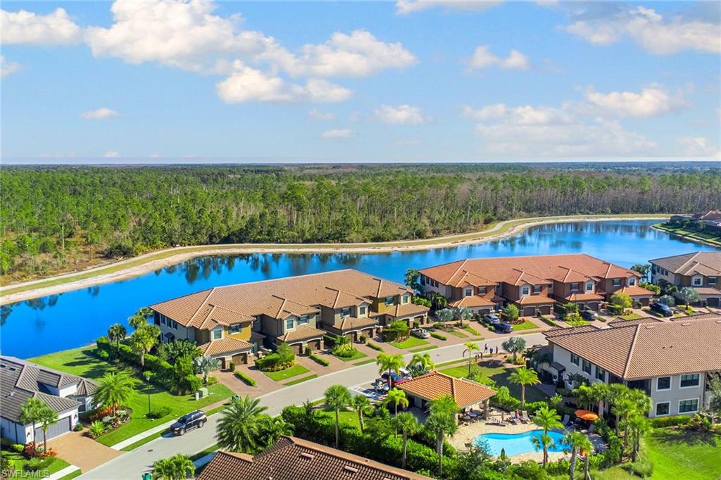 9633 Montelanico Loop, Unit 203 Naples, FL 34119 - Photo 30 of 33 an aerial view of a houses with outdoor space