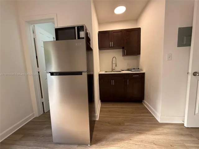 a kitchen with stainless steel appliances a refrigerator and a sink