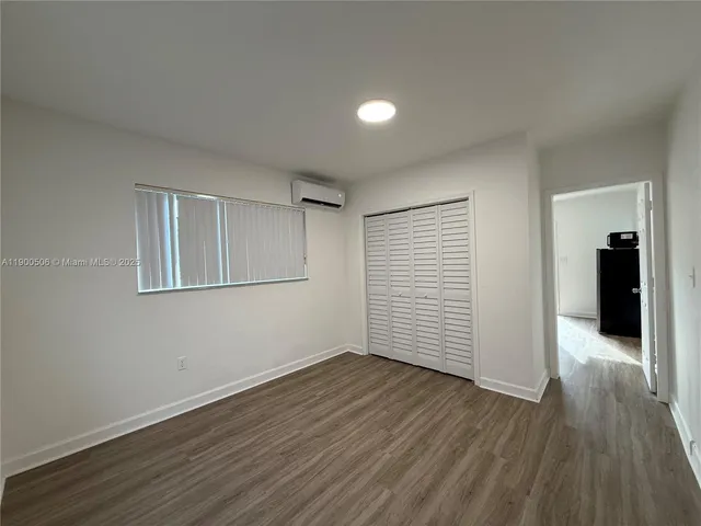 a view of a room with wooden floors and led lights