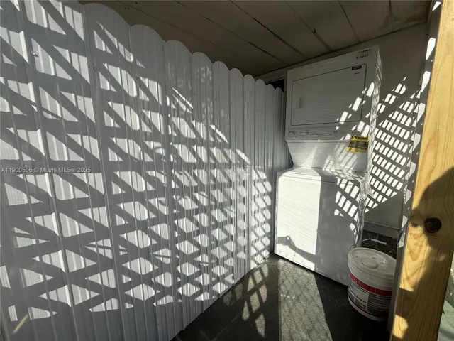 a bathroom with a toilet and shower curtain