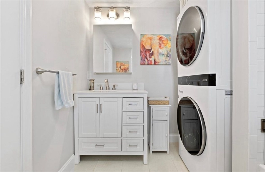 41 Boardman Street, Unit 2 Boston, MA 02128 - Photo 6 of 10 a bathroom with a sink and a mirror