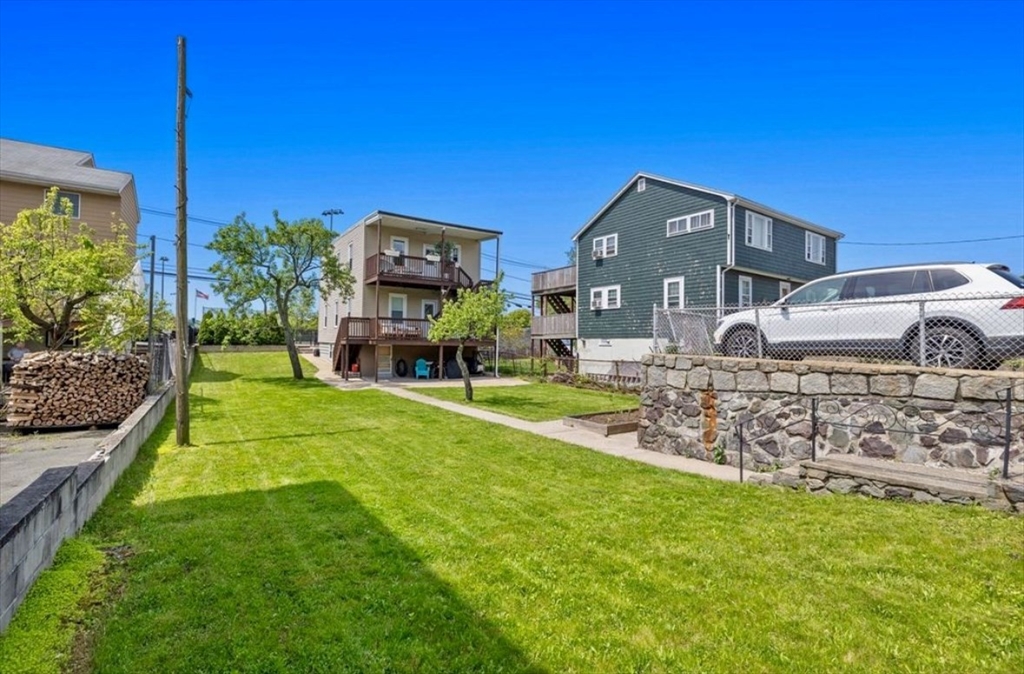 41 Boardman Street, Unit 2 Boston, MA 02128 - Photo 8 of 10 a front view of a house with a garden