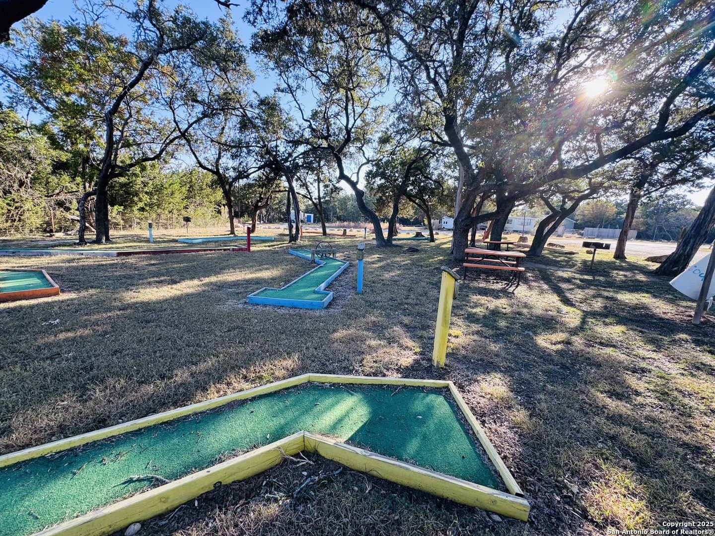 205 Center Point Road Bandera, TX 78003 - Photo 22 of 25 a view of a yard with trees