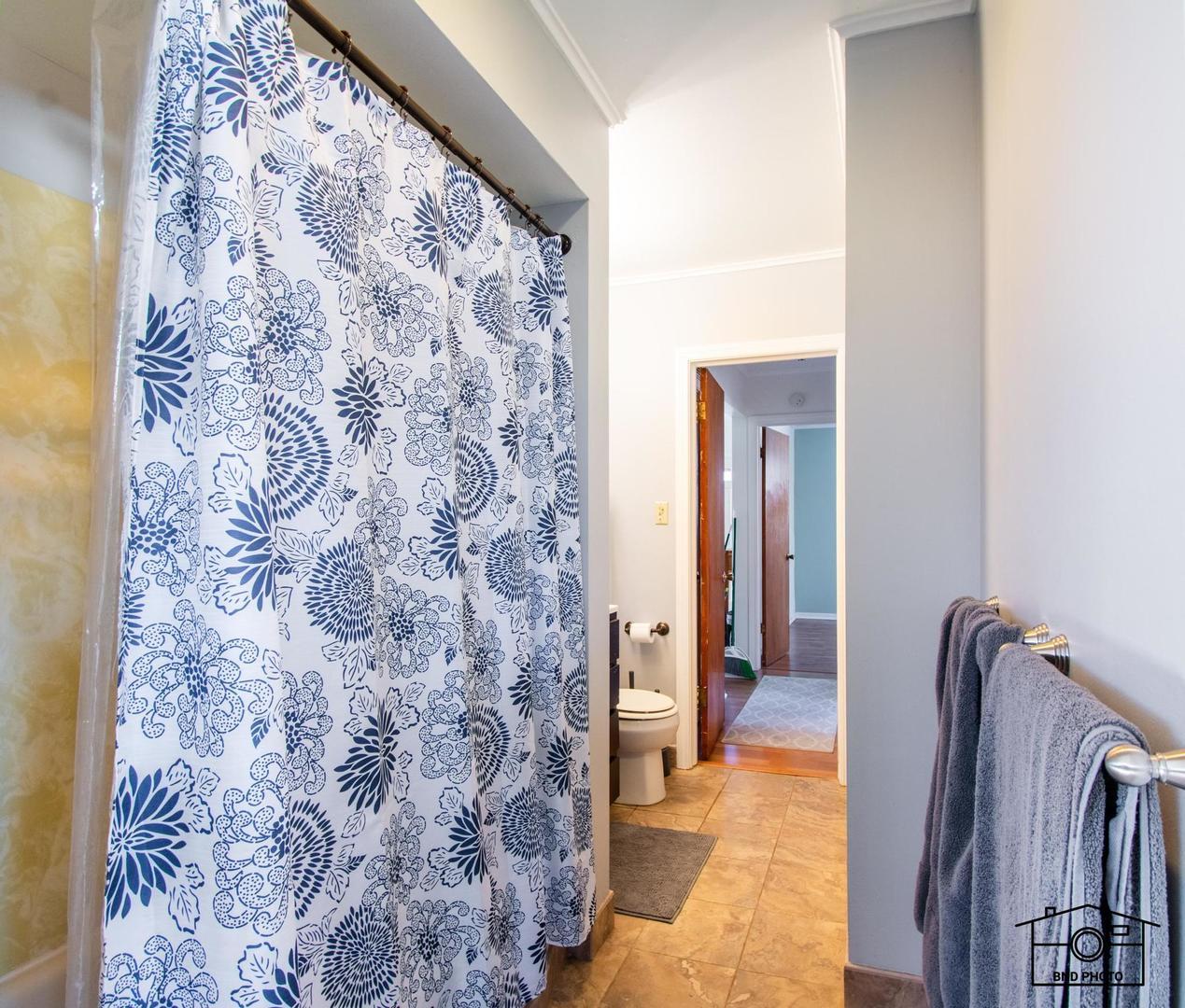 17617 Washington Avenue Homewood, IL 60430 - Photo 12 of 16 a view of a bathroom with a bathtub and a shower