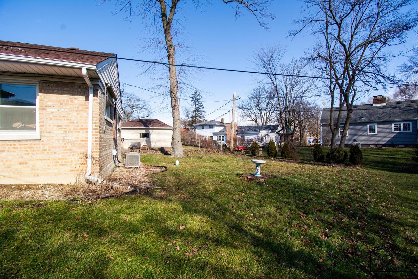 17617 Washington Avenue Homewood, IL 60430 - Photo 13 of 16 a backyard of a house with lots of green space