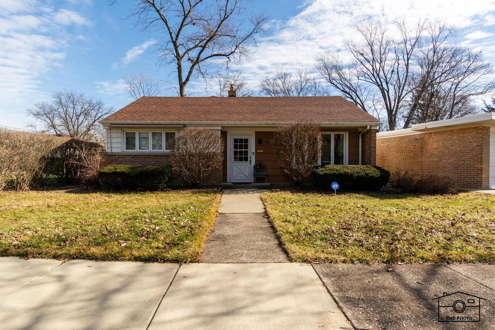 17617 Washington Avenue Homewood, IL 60430 - Photo 2 of 16 a front view of a house with a yard