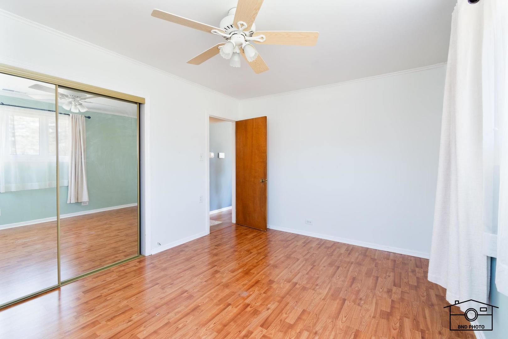 17617 Washington Avenue Homewood, IL 60430 - Photo 5 of 16 wooden floor in an empty room with a window