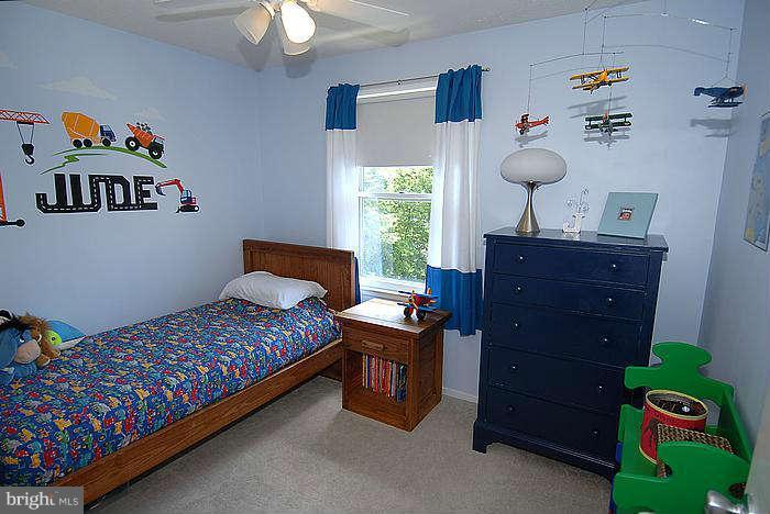 173 West Annandale Road Falls Church, VA 22046 - Photo 12 of 25 a bedroom with a bed and a dresser in it