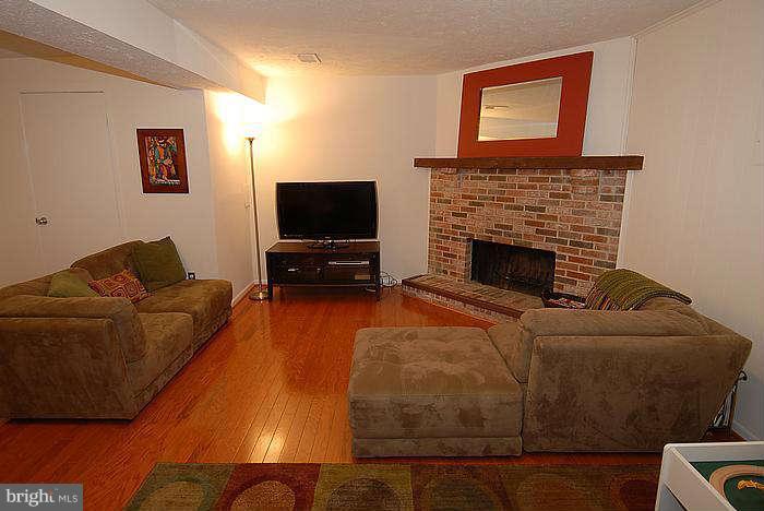 173 West Annandale Road Falls Church, VA 22046 - Photo 14 of 25 a living room with furniture and a flat screen tv