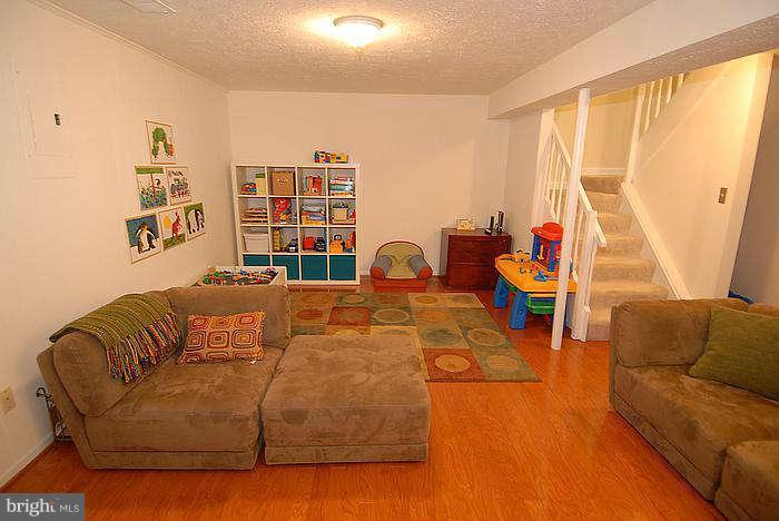 173 West Annandale Road Falls Church, VA 22046 - Photo 15 of 25 a living room with furniture and a large window