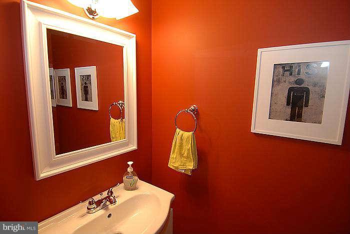173 West Annandale Road Falls Church, VA 22046 - Photo 16 of 25 a bathroom with a toilet sink and mirror
