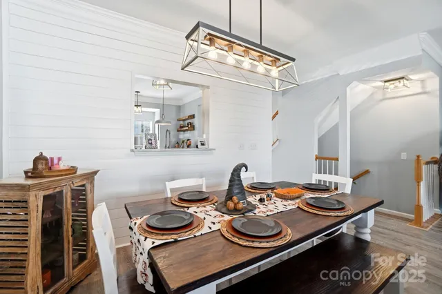 a kitchen with stainless steel appliances granite countertop a refrigerator and a stove
