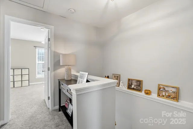 a living room with furniture and a lamp