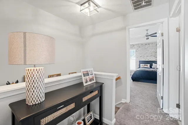 a view of a livingroom with a ceiling fan and window