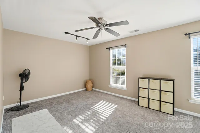 a bathroom with a sink and mirror with toilet