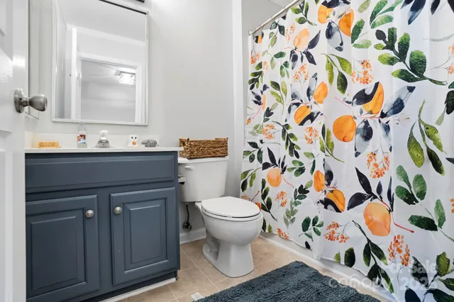 a bed room with a bed and a chandelier