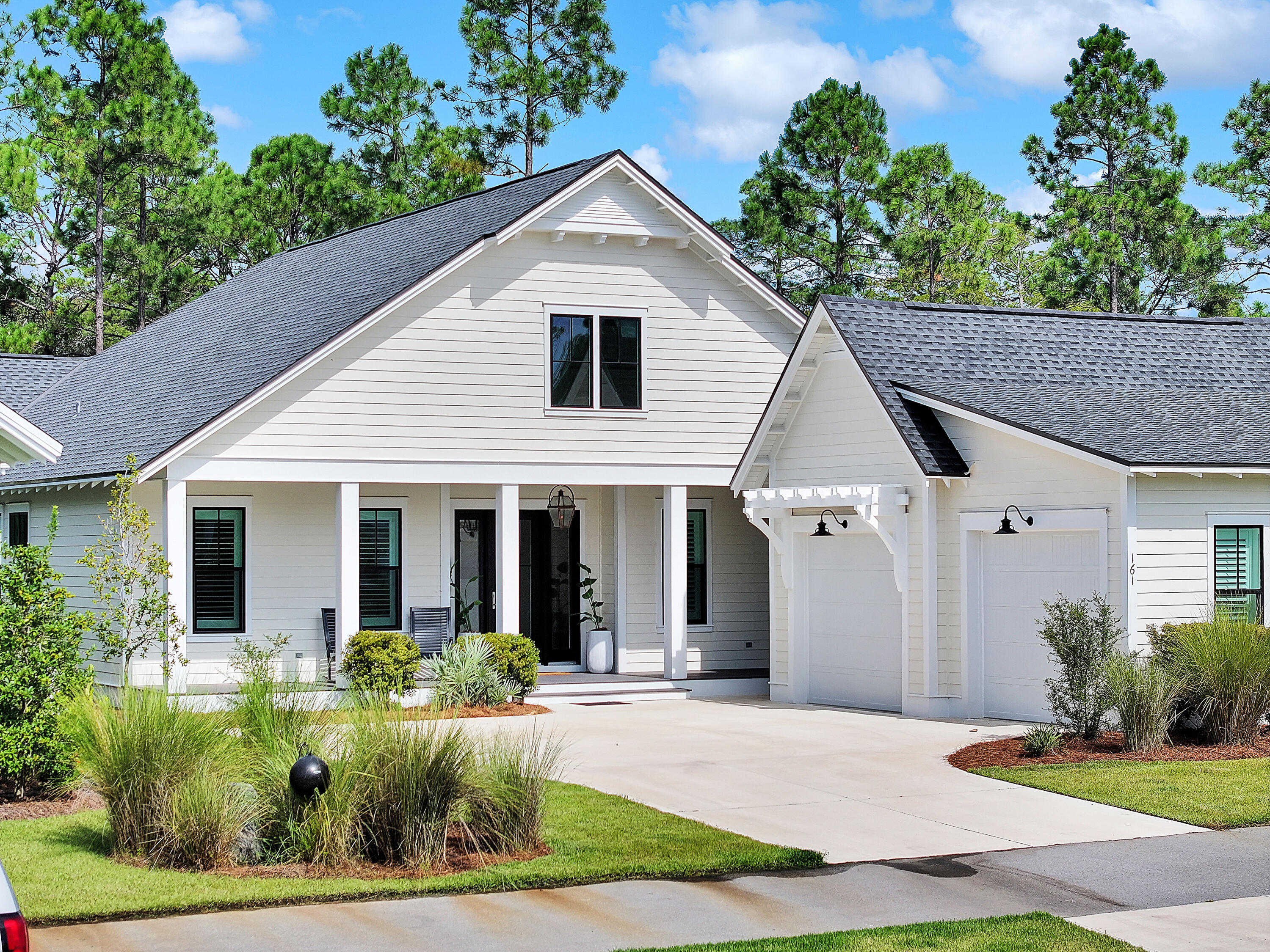 161 Sidecamp Rd Inlet Beach Inlet Beach, FL 32461 - Photo 57 of 66 a front view of a house with a yard and potted plants
