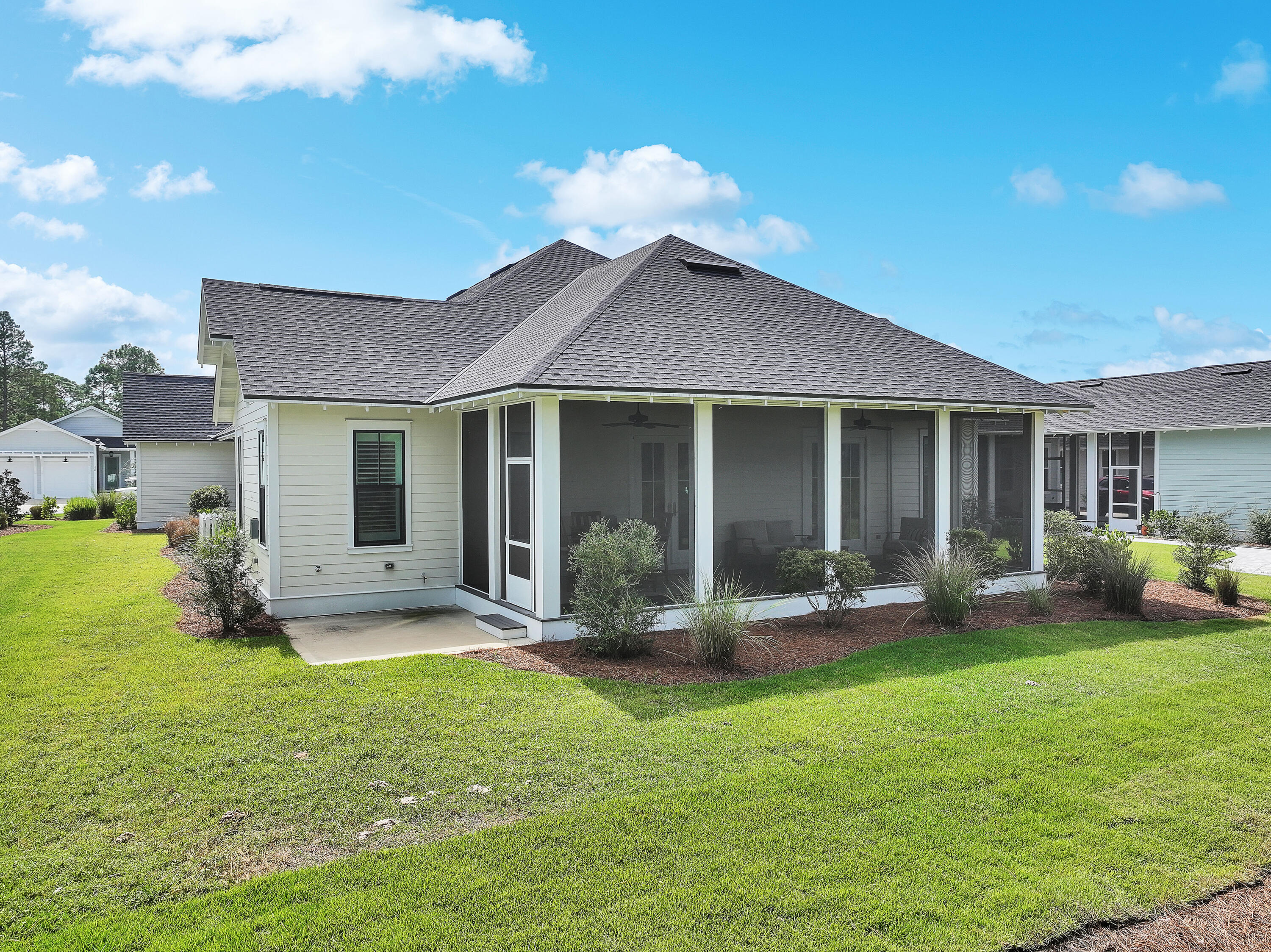 161 Sidecamp Rd Inlet Beach Inlet Beach, FL 32461 - Photo 60 of 66 a front view of a house with a yard and outdoor seating