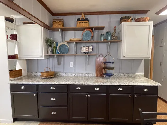 a kitchen with stainless steel appliances granite countertop a sink and cabinets