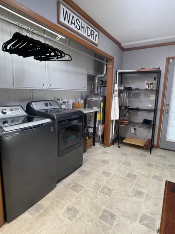 a kitchen with stainless steel appliances granite countertop a sink and cabinets