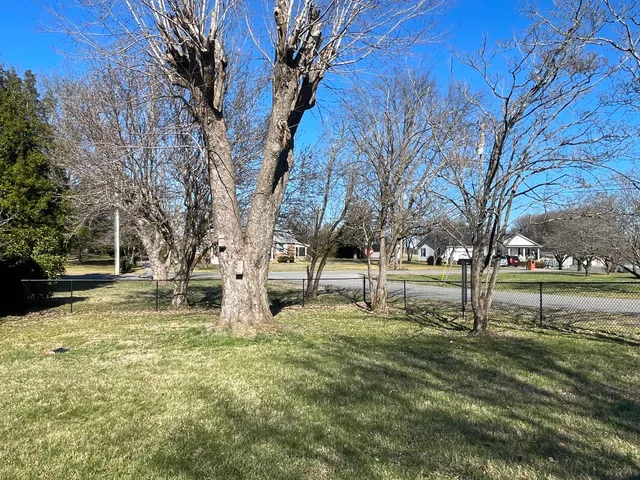 a view of a fountain in front of a house