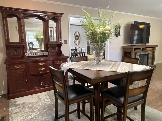 a dining room with furniture and window