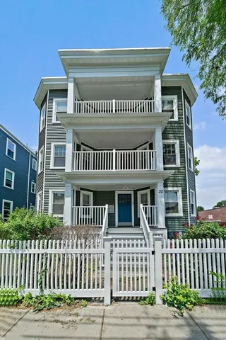 a view of a brick house with a street