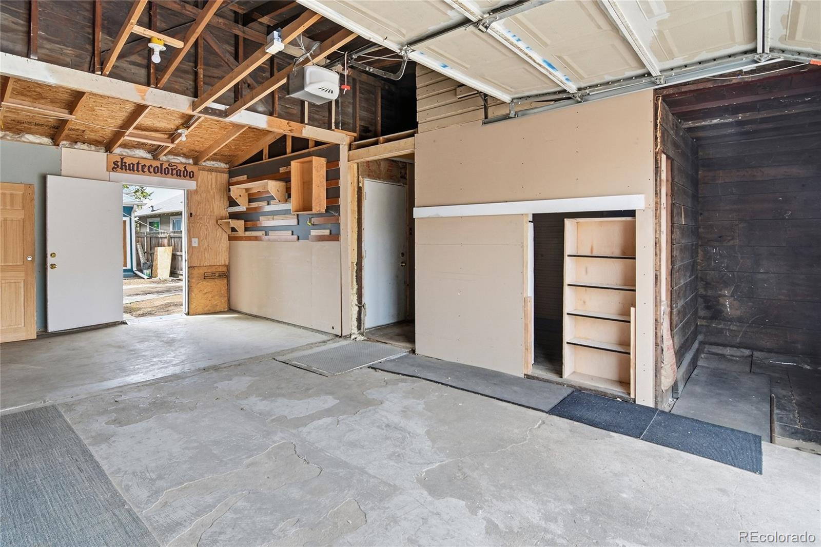4424 Sherman Street Denver, CO 80216 - Photo 14 of 16 a view of a room with wooden walls