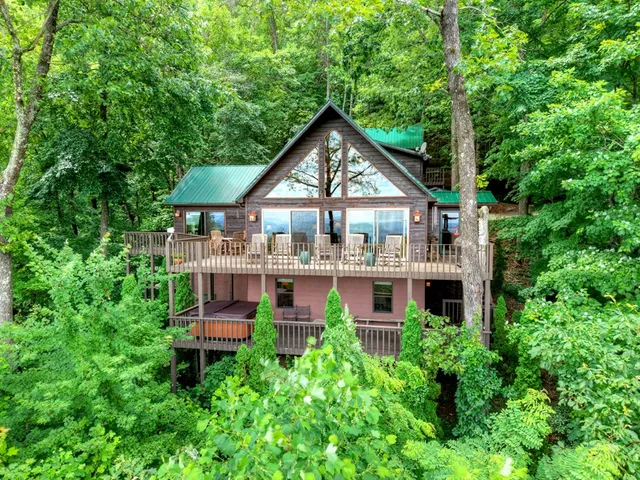 a view of a patio with a table chairs and a backyard