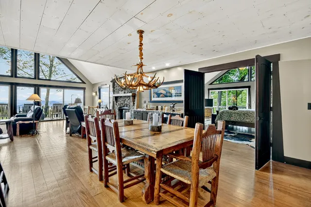 a view of a lake in middle of forest